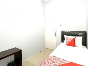Hotel O Guesthouse Pagi Sore Syariah - Zimmer