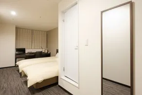 The Premium Hotel In Rinku - Chambre