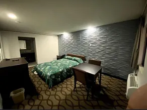 Deluxe Inn - Zimmer