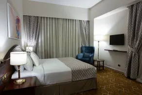 Triumph Plaza Hotel - Chambre