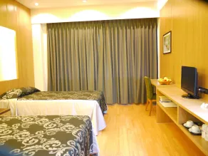 Charoen Hotel - Chambre
