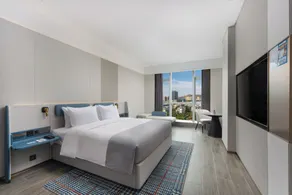 Wanda Yuehua Hotel Urumqi Railway - Chambre