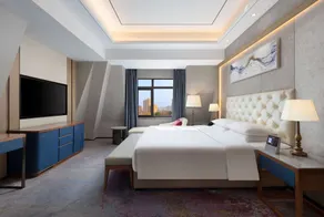 Ramada by Wyndham Zhumadian West Station - Habitación