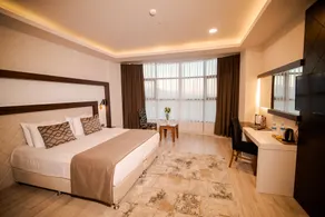 Grand Hotel & Convention Center Karman - Habitación