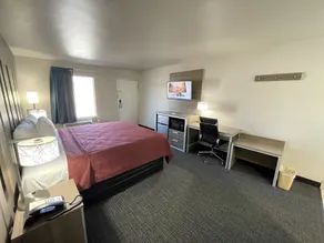 Excellent Inn & Suites - Chambre