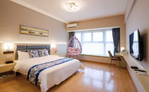 Yue Tu Apartment Hotel - Pokój