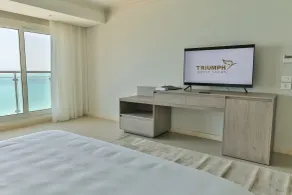 Triumph White Sands Hotel - Chambre