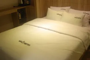 64 Inn Hotel - Zimmer
