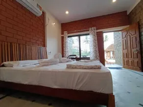 Hampi Delmont Resort - Zimmer