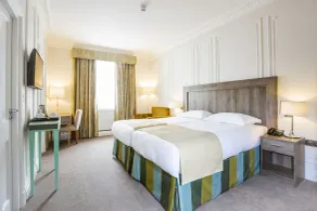 Astor Court Hotel - Chambre