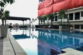 Comfortable Pool View Studio Room at Gateway Park LRT City Jatibening Apartment By Travelio - Pool
