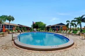 Charming condo with two pools and steps to beach - Pool
