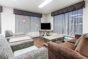 Super 8 by Wyndham Gainesville - Coin salon dans le hall