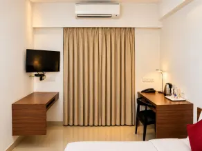 The Altruist Koparkhairane Hotel - Quarto