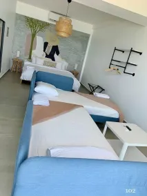 Corcega Beachfront Suites   - Chambre