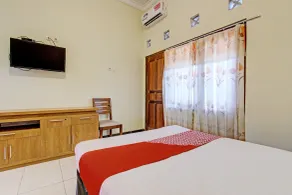 OYO 93660 New Family Hotel Syariah - Chambre