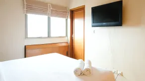 Extra Spacious and Homey 2BR at Kondominium Puncak Marina Apartment By Travelio - Zimmer