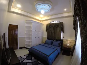 The Executive Villa Inn & Suites - Zimmer