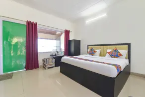 Fabhotel Green Acres - Chambre