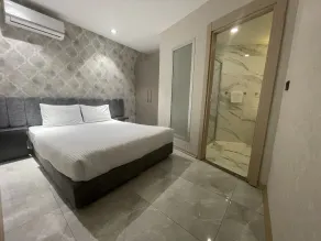Le Luxe Suites Hotel - Habitación