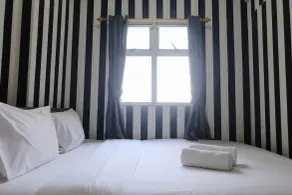 Best Deal 2BR Apartment Suites @Metro By Travelio - Room