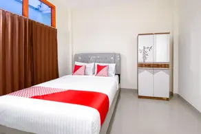 Urbanview Hotel Falah Residence Syariah By RedDoorz - Chambre