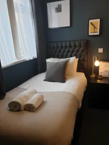 The Metropolitan Guest House - Zimmer