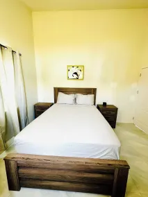 Évadez-vous au paradis - Bungalow tout neuf avec vue sur l'océan à Discovery Bay 1 - Chambre