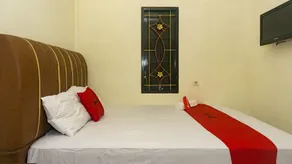 RedDoorz near Sentani Airport Jayapura - Chambre
