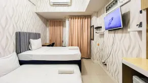 Nice and Cozy Studio at Vida View Makassar Apartment By Travelio - Chambre