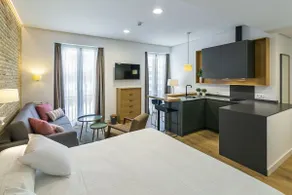 Aquitania Home Suites - Chambre