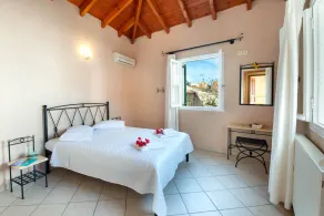 Charming Lakka Retreat: Angelina Apartment with A/C and Central Square Balcony - Image 4