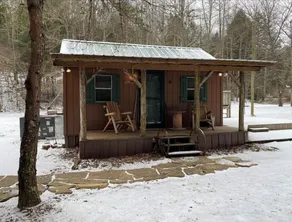 Peaceful cabin in secluded mountain spot beside a picturesque creek - Image 4