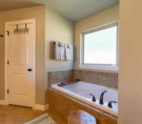 Peaceful 3BR Base • Close to NWA Events & Trails. Secure Garage and Jetted Tub. - Image 4