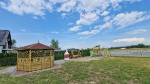 A modern house with a large garden and a place for relaxation + fun for children - Image 4