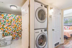 This centrally located 3 bedroom 2 bathroom features a full size pool and electric vehicle charging on site. - Image 4