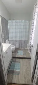 Cozy bedroom with private bathroom, and separate, direct access entrance. - Image 3