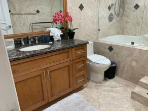 Entire condominium with a pool view, steps from the beach - Image 2