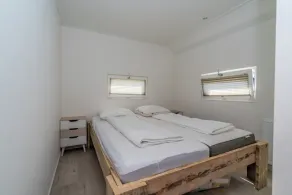 This chalet has an extra spacious living room and two sitting areas, one of which is situated by the - Image 4
