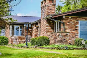 We are a quiet ranch home that sits on 8 acres with firepit, pond and bar. - Image 5