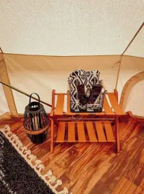 A luxurious glamping tent nestled in the trees. - Image 3