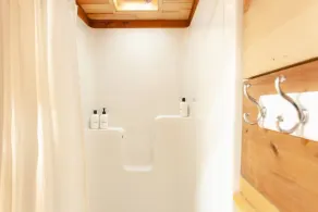 Secluded 1-bedroom lakefront cabin in Lakeside, OR. Ideal for writers or couples seeking solitude. Features a King bed, wood stove, kayak for 2, and stargazing from your private dock. - Image 5