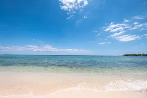 Walk onto the white sandy beach of Half Moon Bay from your patio door! - Image 3