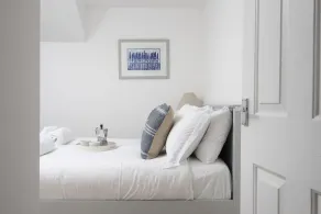 Situated only sixty meters from the Blue Flag sandy beach in the charming coastal village of Porthto - Image 5