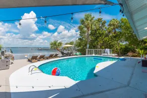 Aquatopia North: Riverfront beach house, w/ dock, heated pool + hot tub & more! - Image 2