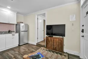 Queen bed, kitchenette, living room/couch. - Image 5