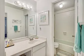 One-bedroom sleeps 4 with sleeper sofa, complex has 2 pools, tennis courts, playground, large pond, walking distance to pier village and less than a mile to public beach access. - Image 5