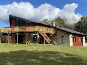 The eclectic lodge sits on 10 acres and is within 40 minutes from 3 ski resorts.  - Image 5