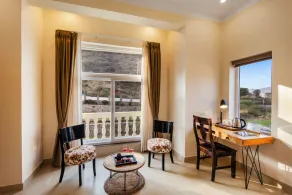 ELIVAAS Signature Mandovar Mountain Valley Retreat Pet-friendly Suite Room with Shared Pool, Garden, Restaurant & Hill Views - Image 4