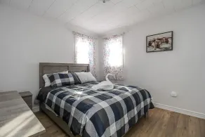 A cozy family retreat surrounded by trees, Nature, comfort and family memories. - Image 4